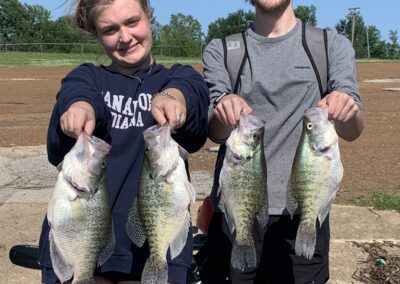 duo holding fish in both hands