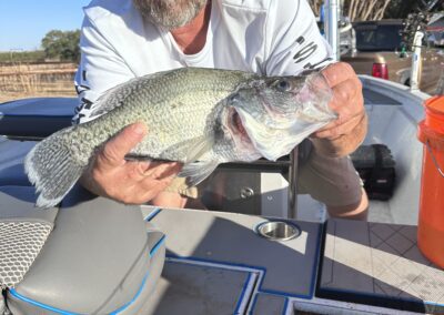 holding fish with both hands