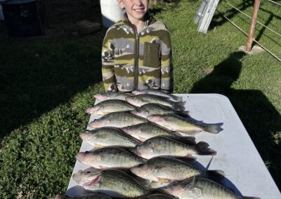 boy clicking photo with fish