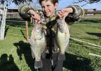 boy clicking photo with fish